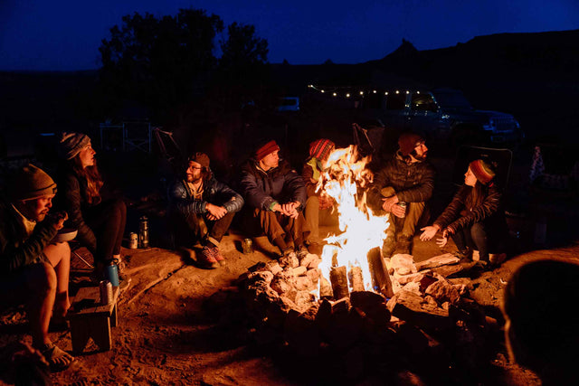 Moon Community sitting around a campfire